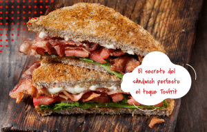 “Sándwich crujiente con bacon y tomate con mensaje El secreto del sándwich perfecto el toque Tosfrit